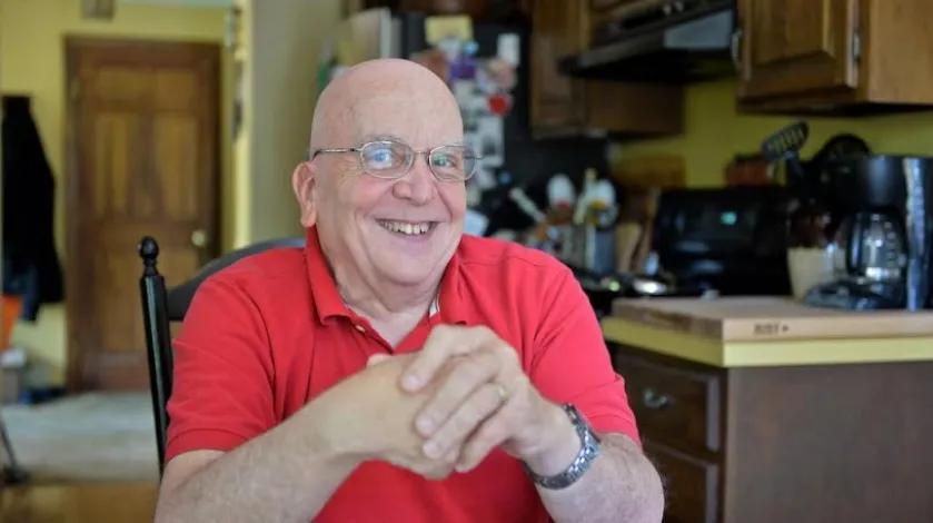 Tom Silvia of Plymouth sits at his kitchen table